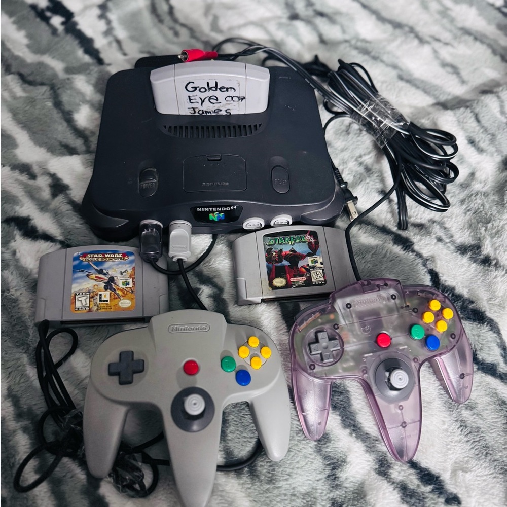 Nintendo Console with Gray and Purple Controllers